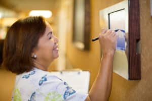 a caregiver in the hallway at Poway Healthcare