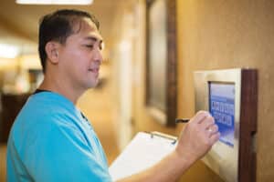 a caregiver in the hallway at Poway Healthcare