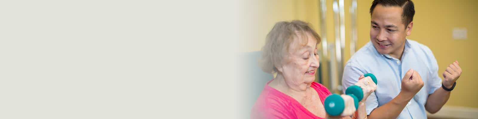 rehab therapist and resident in the rehab gym at Poway Healthcare